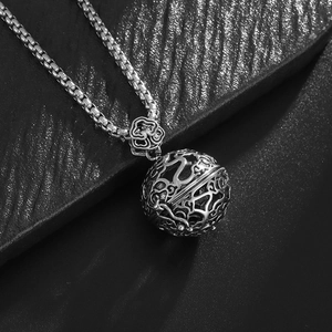 Macro shot of a vintage hollow spherical incense burner pendant with intricate carvings