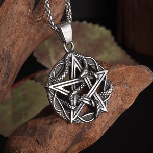 Macro shot of silver snake pentagram pendant with detailed scales on a square link chain