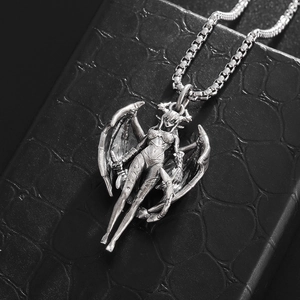 Macro shot of Gothic winged succubus pendant in vintage silver finish on black leather box