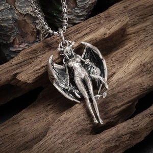 Detailed macro view of Gothic demon wing girl pendant with oxidized vintage alloy finish