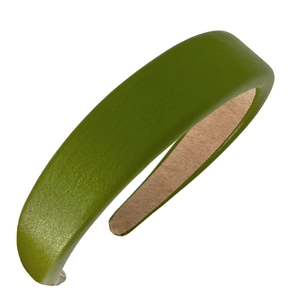 Elegant green faux leather wide headband with textured lychee grain on a white background