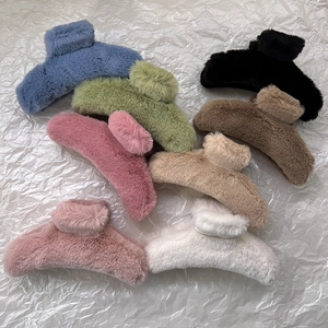 Large plush hair claw clips in eight colors including blue and pink for thick hair styling