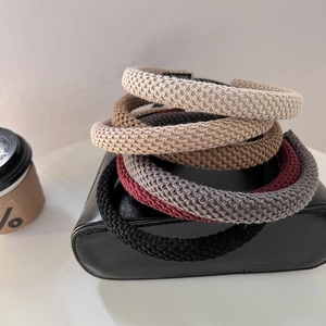 Detail showing the thick knitted texture and variety of colors for this elegant headband set
