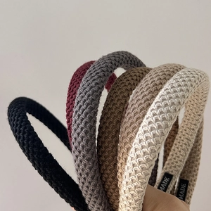 Detail of knitted waffle texture headbands in various colors with high-quality fabric finish
