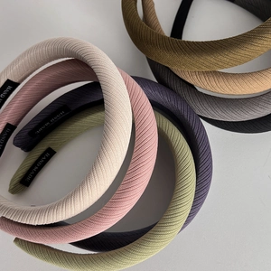 Macro detail of twill fabric texture and handmade label on sponge padded headbands