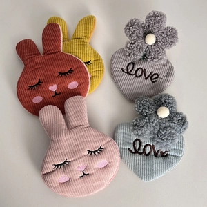 Plush bunny and heart hair clips set made of corduroy with floral embroidery for women