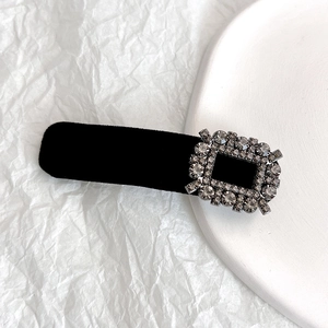 Elegant black velvet hair clip with a vintage-style sparkling rectangular crystal buckle