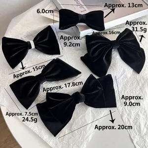 Elegant black silk velvet bow hair clips in various sizes for stylish women hair accessories