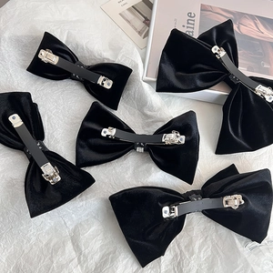 Elegant black velvet bow hair clips with silver spring mechanism for women
