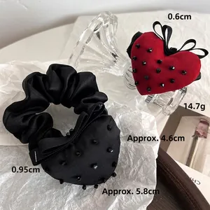 Elegant red and black velvet strawberry hair scrunchies with sparkling rhinestone details