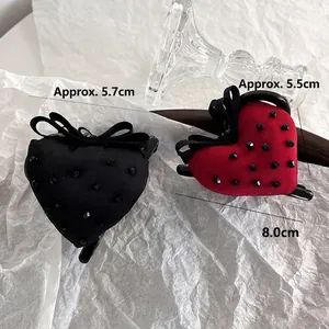 Handmade strawberry-style heart hair claws with crystals and bows in black and red colors