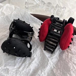 Elegant Korean style large strawberry hair claw clips in classic black and festive red colors