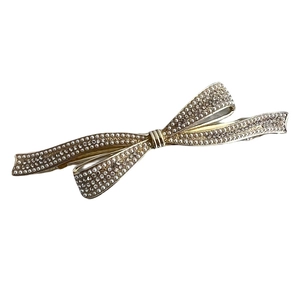 Eleganter goldener Haarclip in Schleifenform mit weißen Perlen und Strasssteinen