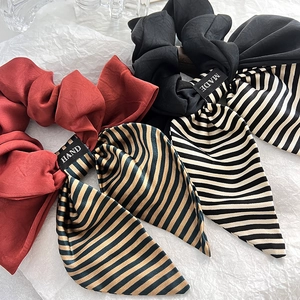Elegant satin bow scrunchies with striped ribbons in red-brown and black finish