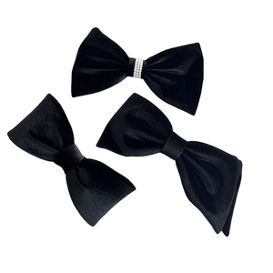Elegant black velvet bow hair clips set featuring a pearl embellished center design
