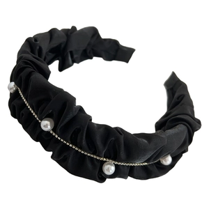 Elegant black pleated fabric headband featuring white pearls and shiny rhinestone trim detail