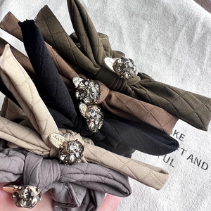 Set of five elegant quilted fabric bow hair ties with vintage rhinestone accents