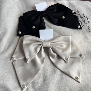 Elegant satin bow hair clip with faux pearls in black and champagne gold colors