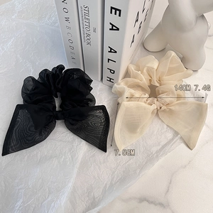 Chouchou élégant en organza avec grand nœud, coloris noir et beige champagne