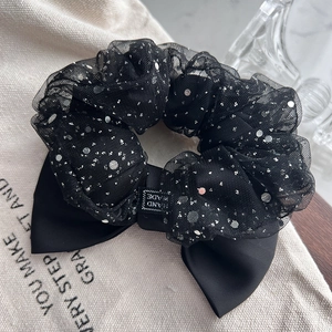 Elegant black mesh scrunchie with silver sequins and a satin bow hair accessory