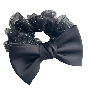 Elegant black satin bow scrunchie with sparkling silver sequins for women hairstyles