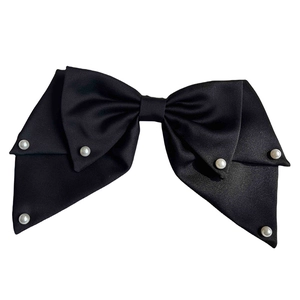 Elegant black satin bow hair clip with white pearl accents on a white background