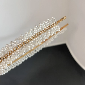 Elegant gold headband with multi-row white pearls and crystals in a minimalist style