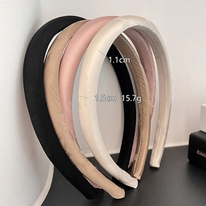 Set of four jacquard satin padded headbands in black, champagne, pink, and cream colors