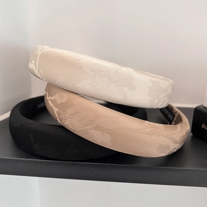 Three-piece set of jacquard sponge headbands in white, beige, and black floral fabric