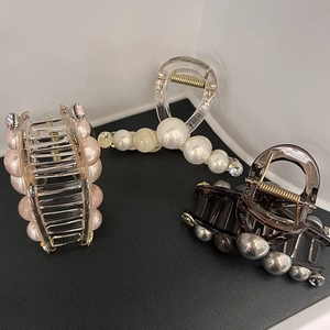 Elegant French hair claws with pearls and rhinestones in pink, white, and brown shades