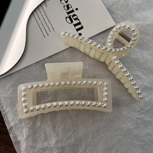 Two-piece set of cream white oversized hair claws with pearls and rhinestones