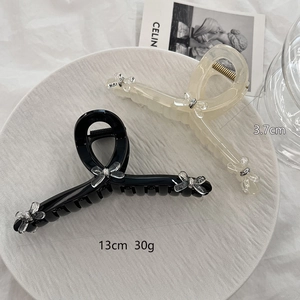 Large 13cm bow hair claw clips in black and cream beige, elegant minimalist hair accessory