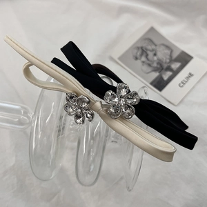 Elegant satin bow hair ties with floral rhinestone detail in black and cream white