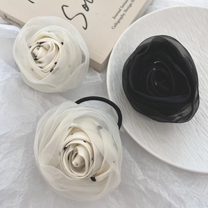 Elegant organza rose flower hair tie in black and white polka dot pattern