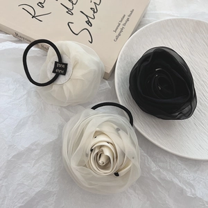 Elegant handmade organza rose hair scrunchies in black, cream, and polka dot patterns