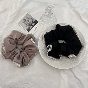 Elegant satin hair scrunchies with pearl mesh edges in classic black and mocha brown colors