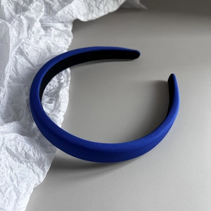 Close-up of royal blue fabric headband with suede texture and minimalist design style