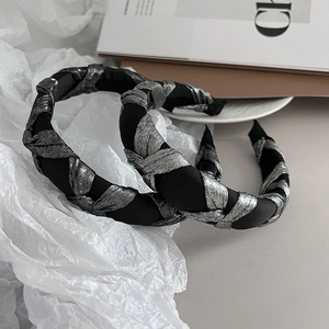 Retro padded headband with twisted black and silver metallic fabric for voluminous hair
