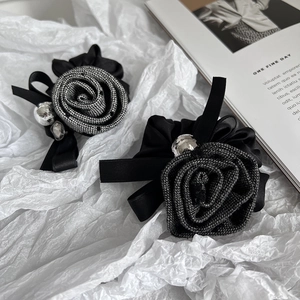 Elegant Camellia flower hair tie with fabric rose and metallic beads in chic black