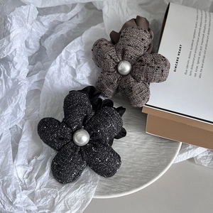 Elegant tweed flower hair ties with pearl centers in black and brown colors