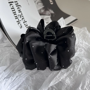 Elegant black flower hair claw clip with sparkly sequins and silk-like fabric texture
