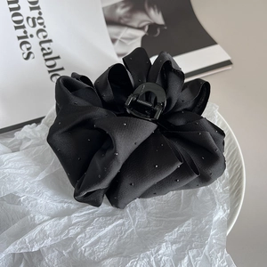 Large black fabric flower hair claw clip with silver rhinestones and satin petals
