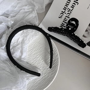 Elegant black hair accessories set with pearls and rhinestones on fabric headband and clip
