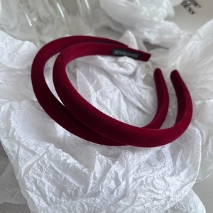 Burgundy velvet padded headband set in handmade sponge design on art paper