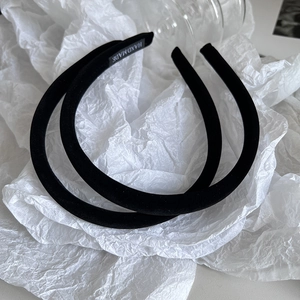 Elegant velvet padded headband in black color featuring a handmade high-top crown design