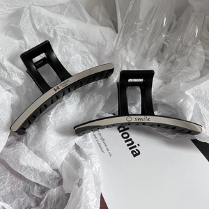 Elegant large black matte hair claws with silver letter engraving and smooth metal finish
