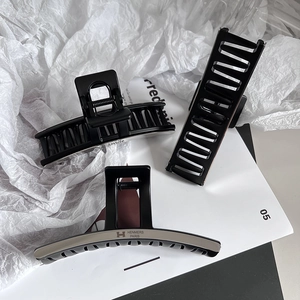 Sleek matte silver titanium steel hair claw clips set in various sizes for thick hair