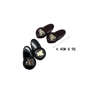Fermagli per capelli orso in acrilico nero con motivo dorato e misura di taglia 4,4cm