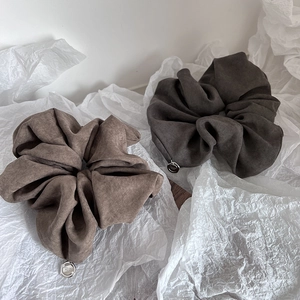 Elegant large fabric scrunchies in brown and charcoal gray with silver metal pendants