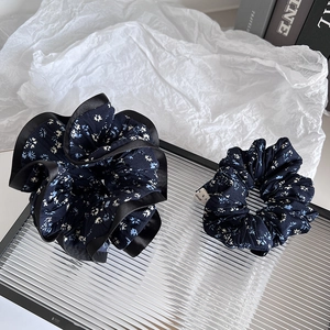 Navy floral scrunchie set with chiffon ruffles and elegant blue flower patterns